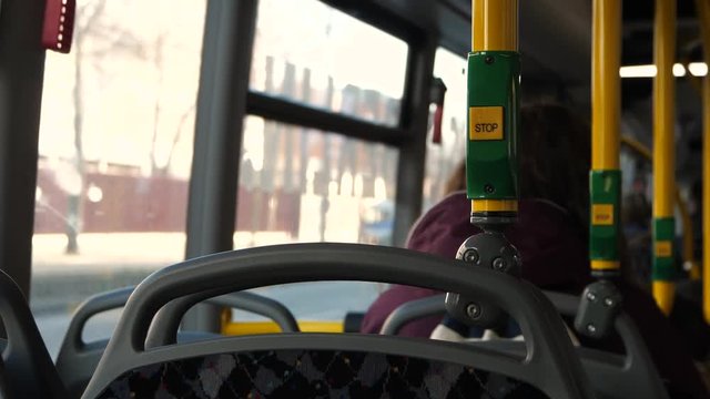 Footage of green yellow button from inside bus, public transport in Berlin Germany.