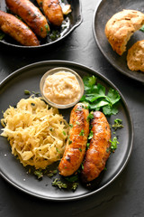 Fried sausages with sauerkraut and horseradish