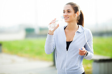 Sports woman after sports exercises in the urban environment