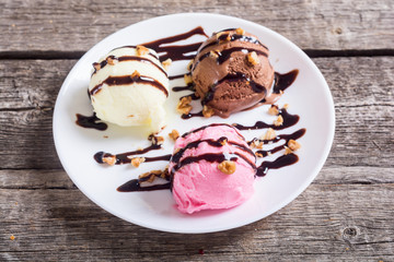 Ice cream with walnuts and chocolate topping