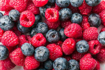 Fresh Summer Berries mix Background with Strawberry, Raspberry, Red currant, Blueberry and Blackberry.