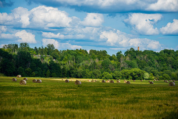 blue sky with white clouds over countryside landscape