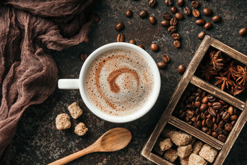 Coffee board with coffee beans on dark textured background.