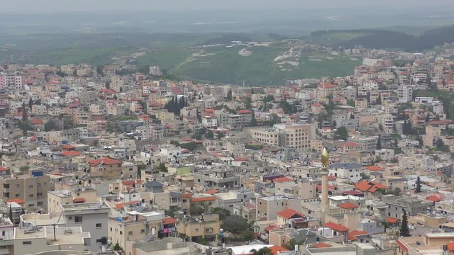 Skyline of Umm El Fahm, an Arab town with citizens of Israel. Umm al-Fahm is the social, cultural and economic center for residents of the Wadi Ara and Triangle regions.