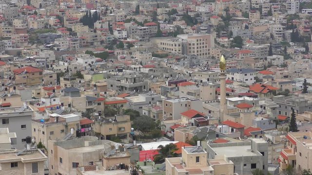 Skyline of Umm El Fahm, an Arab town with citizens of Israel. Umm al-Fahm is the social, cultural and economic center for residents of the Wadi Ara and Triangle regions.