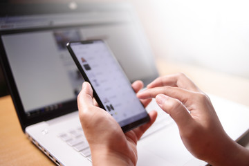 Businessman Holding and Using Smart Phone