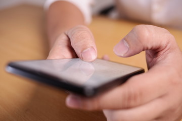 Businessman Holding and Using Smart Phone