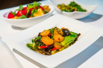 Chinese cuisine. Scallops and black mushrooms