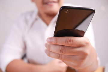 Businessman Holding and Using Smart Phone