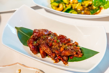 Chinese cuisine. Fried pieces of meat in pepper sauce