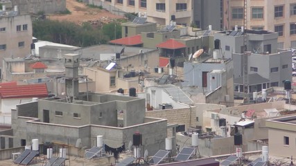 Skyline of Umm El Fahm zoom, an Arab town with citizens of Israel. Umm al-Fahm is the social, cultural and economic center for residents of the Wadi Ara and Triangle regions.