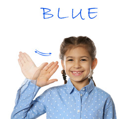 Little girl showing word BLUE on white background. Sign language