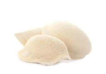Fototapeta na wymiar Raw dumplings with tasty filling on white background
