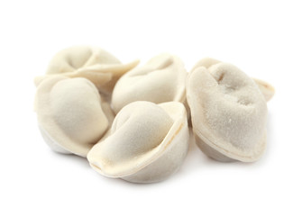 Pile of raw dumplings on white background