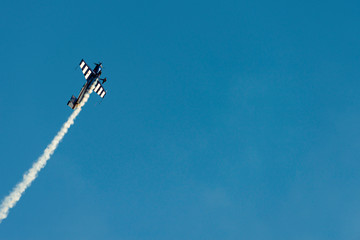 Airplane acrobatics in air show.