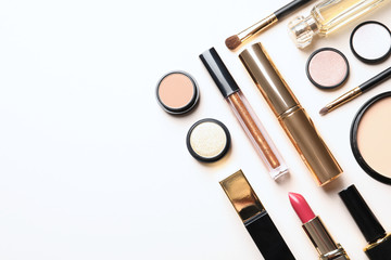 Obraz premium Different luxury makeup products on white background, top view