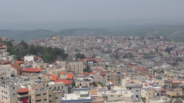 Skyline of Umm El Fahm, an Arab town with citizens of Israel. Umm al-Fahm is the social, cultural and economic center for residents of the Wadi Ara and Triangle regions.