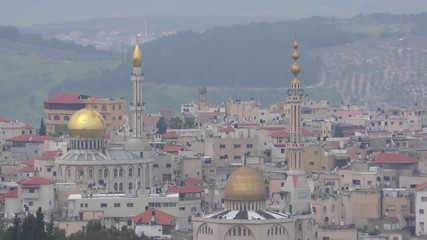 Mosques and minaret in Umm El Fahm, an Arab town with citizens of Israel. Umm al-Fahm is the social, cultural and economic center for residents of the Wadi Ara and Triangle regions.