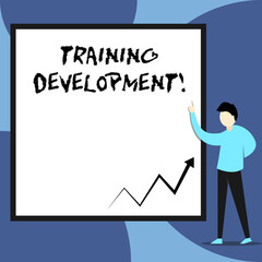 Word writing text Training Development. Business photo showcasing Learn and Expand skills and knowledge Program View young man standing pointing up blank rectangle Geometric background