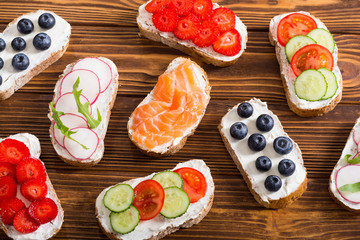 Variation of toast with fruit , vegetable and salmon