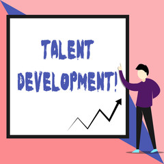 Text sign showing Talent Development. Business photo text Building Skills Abilities Improving Potential Leader View young man standing pointing up blank rectangle Geometric background