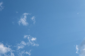 blue sky with white clouds over countryside landscape