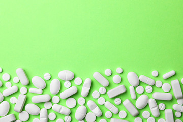 Different pills on color background, top view. Space for text