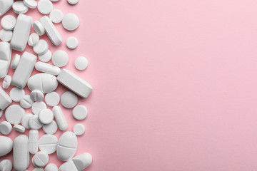 Different pills on color background, top view. Space for text