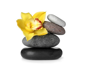 Spa stones and beautiful orchid on white background