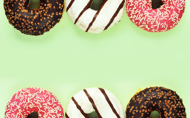 Delicious donuts on colorful background.
