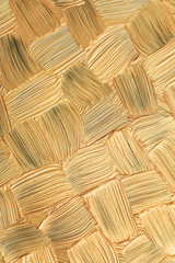 Golden paint brush strokes as background, closeup