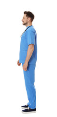 Fototapeta premium Full length portrait of smiling male doctor in scrubs isolated on white. Medical staff