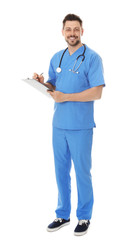 Full length portrait of smiling male doctor in scrubs with clipboard isolated on white. Medical...