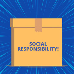 Writing note showing Social Responsibility. Business concept for Obligation for the Benefit of Society Balance in life Close up front view brown cardboard sealed box lid. Blank background
