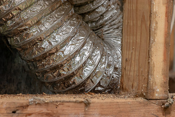 matalic tubing bent around inside a chiminey