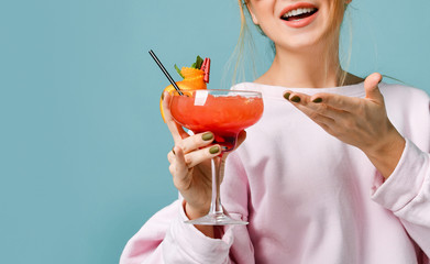 Closeup portrait of Bartender woman with strawberry margarita cocktail in hand in red sunglasses