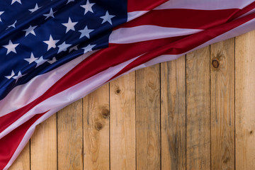 Flag of the United States of America on wooden background. USA holiday of Veterans, Memorial, Independence and Labor Day.