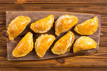 Latin American baked beef empanadas with sauce