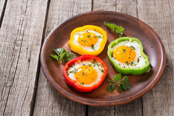 Yellow , red and green pepper with fried eggs