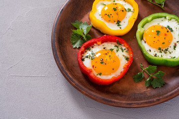 Yellow , red and green pepper with fried eggs