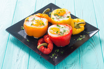 Baked pepper stuffed with bacon and eggs
