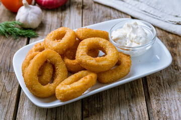 Rings of squid in batter with sauce