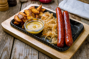 sausages with cabbage and potatoes on board