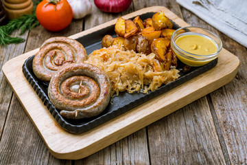 fried snail sausages on the Board