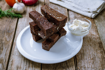 fried Garlic croutons on white plate