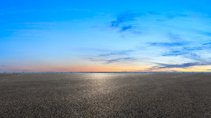 Asphalt road and sunset sky