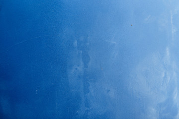Bright abstract dirty blue texture with scratches and scuffs