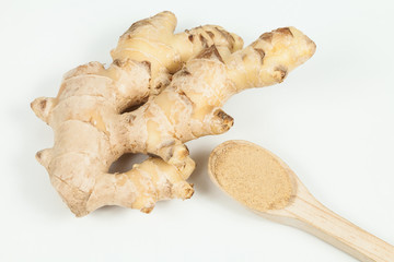 Fresh roots and ginger powder - Zingiber officinale; photo on neutral background