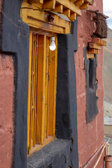 An old traditional window in a Tibetan house in the Himalayan mountains. 