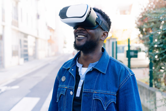 black man using VR headset